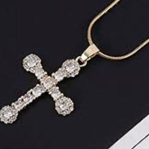 Elegant Gold and Silver Cross Pendant.